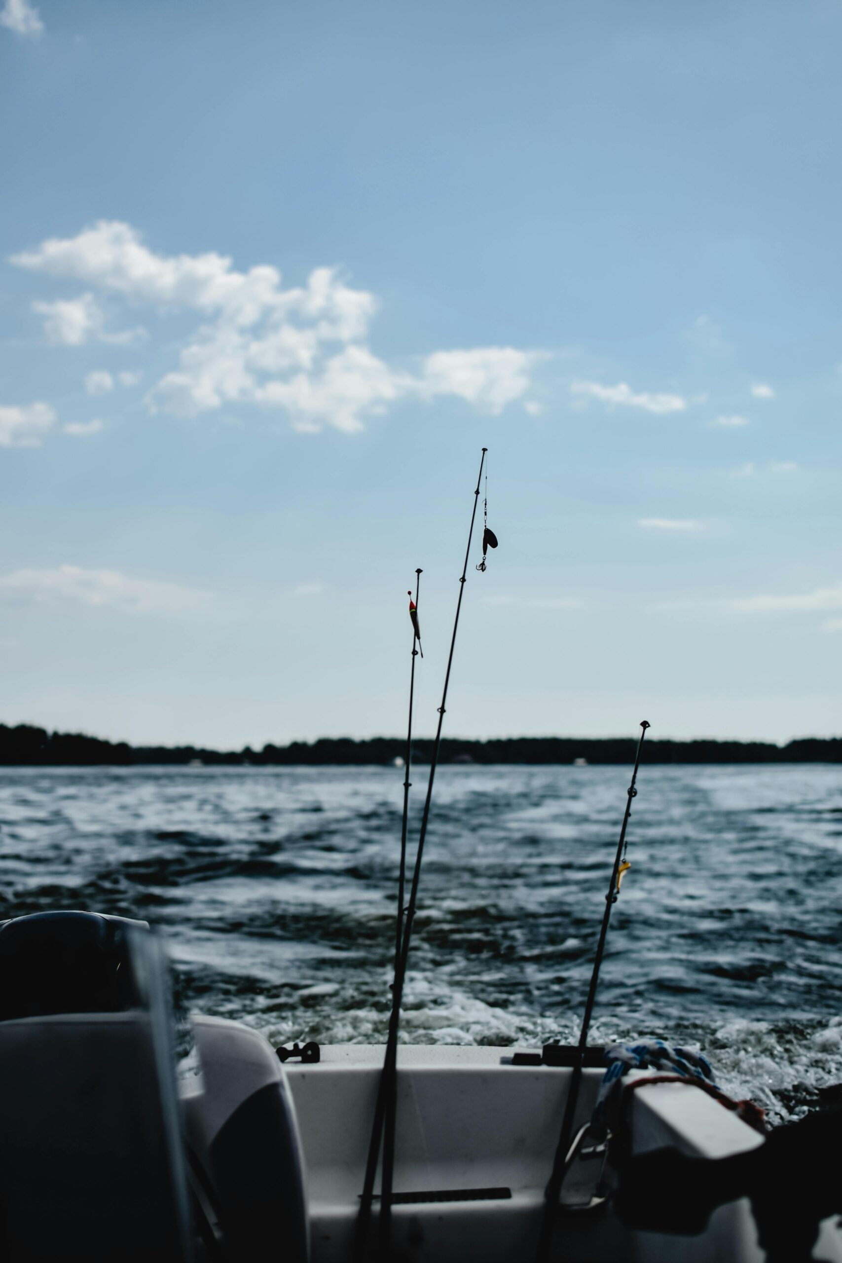 A scenic view of fishing rods on a motorboat in the Finnish sea. Perfect for outdoor enthusiasts.